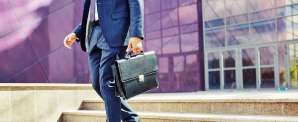 man walking down steps with briefcase